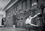 ca. 1940s --- Computer operators program ENIAC, the first electronic digital computer, by plugging and unplugging cables and adjusting switches. | Location: Mid-Atlantic USA. --- Image by © CORBIS